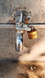 Close-up of padlocks hanging on wall