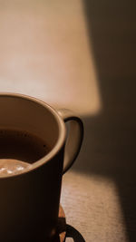 Close-up of coffee cup on table