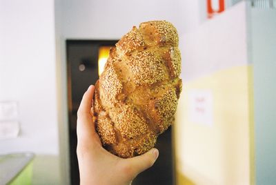 Close-up of hand holding bread