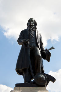 Low angle view of statue against sky