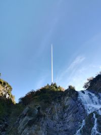 Low angle view of vapor trail against sky