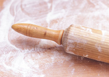 Close-up of rolling pin on table