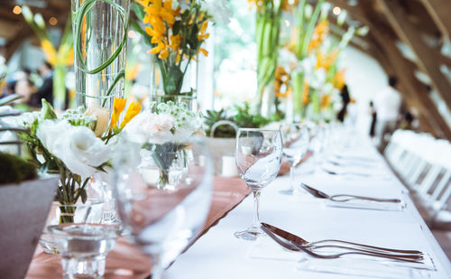 Flowers in glass vase on table