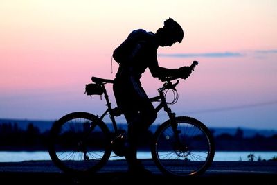 Silhouette of people at sunset