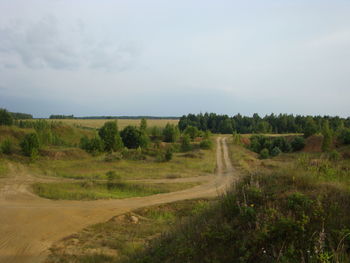 Empty road along countryside landscape
