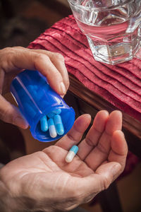 Close-up of hands holding glass