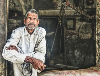 Portrait of man sitting outdoors