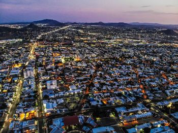 High angle view of illuminated buildings in city