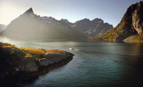 Scenic view of sea against mountains and sky