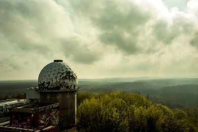 Scenic view of landscape against cloudy sky