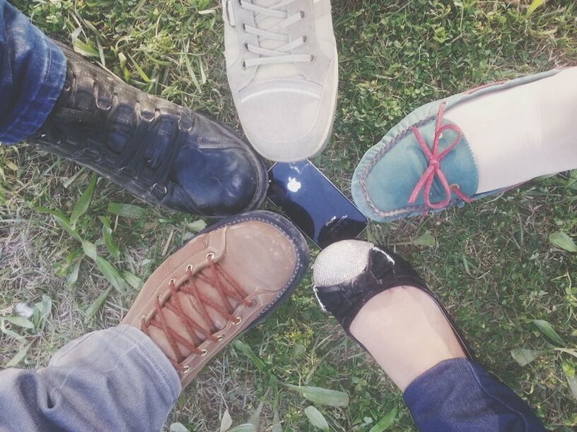 low section, person, shoe, personal perspective, human foot, lifestyles, grass, footwear, high angle view, leisure activity, jeans, part of, men, standing, field, directly above, canvas shoe