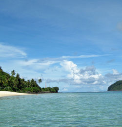 Scenic view of sea against cloudy sky