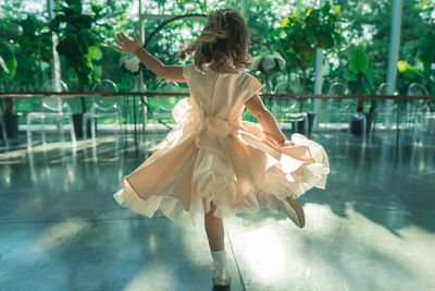 Woman standing by swimming pool