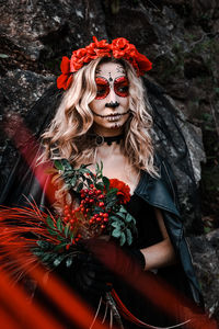 Woman with red flowers