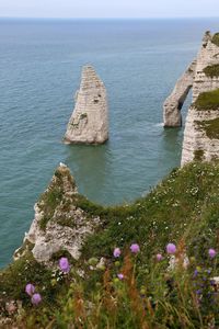 Scenic view of rock formation by sea at etretat