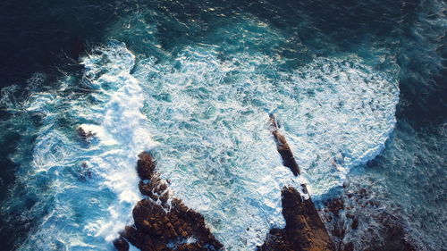 High angle view of waves in sea