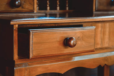 Close-up of wooden drawer at home