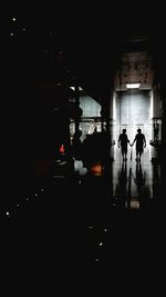 High angle view of people walking on street at night