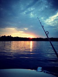 Scenic view of lake at sunset