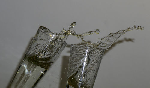 Close-up of water splashing on glass