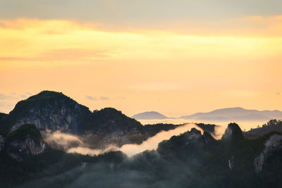 Fog along the mountain in the morning.