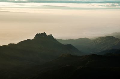 Scenic view of mountains against sky during sunset