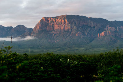 Scenic view of mountains against dramatic sky