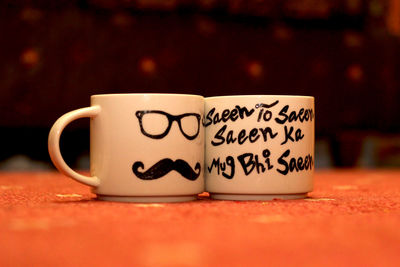 Close-up of coffee cup on table