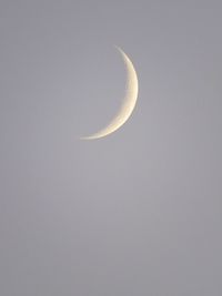 Low angle view of moon against sky at night