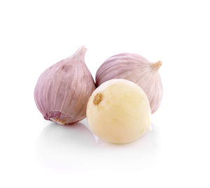 Close-up of pumpkins against white background