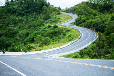 Curved and winding asphalt road in high mountains