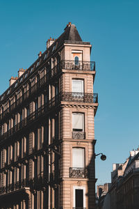 Low angle view of building against blue sky