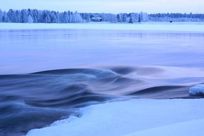 Scenic view of snow covered lake