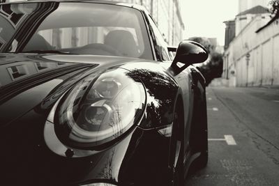 Reflection of car on street