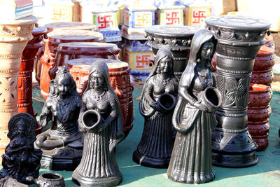 Close-up of statues for sale in market