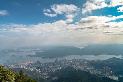 High angle view of buildings and mountains against sky