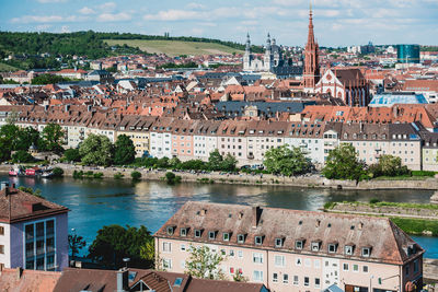 High angle view of river by buildings in town