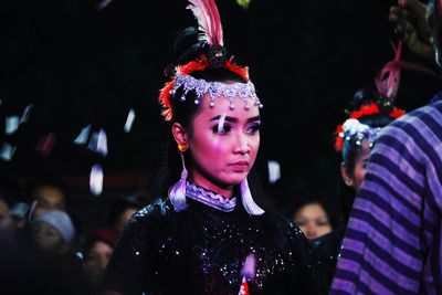 Portrait of woman standing in traditional clothing