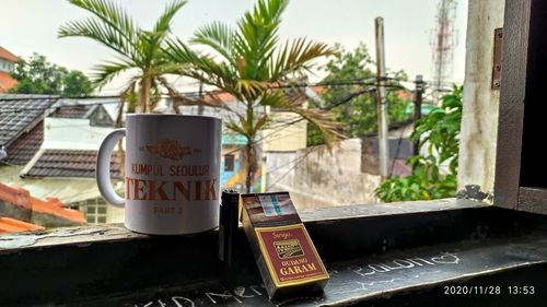 Close-up of information sign on table