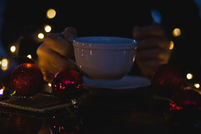 Close-up of illuminated candles on table