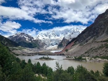 Scenic view of lake and mountains against sky