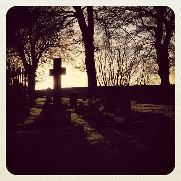 tree, silhouette, bare tree, transfer print, tranquility, auto post production filter, branch, sky, tree trunk, tranquil scene, sunset, nature, built structure, scenics, cemetery, architecture, landscape, field, no people, park - man made space