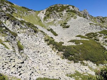 Low angle view of rocks against sky