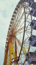 Low angle view of ferris wheel against sky