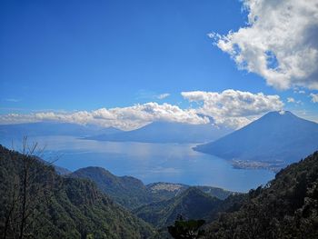 Scenic view of mountains against cloudy sky