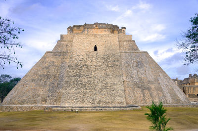 Low angle view of old ruin building against sky