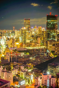 Illuminated buildings in city at night