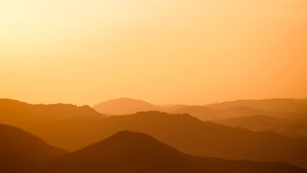 sunset, beauty in nature, nature, mountain, tranquil scene, tranquility, silhouette, scenics, outdoors, no people, mountain range, sky, day