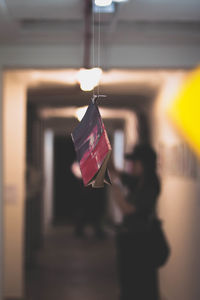 Close-up of man hanging in glass