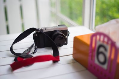 Close-up of camera on table